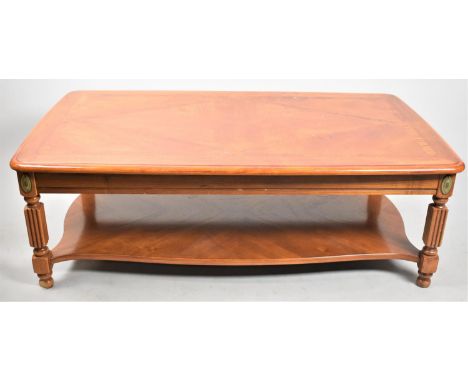 A Modern Rectangular Coffee table with Ormolu Mounts and Cross Banded tops, with Reeded Supports and Stretcher Shelf, 116cms 