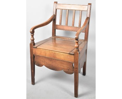 A Late Victorian/ Edwardian Oak Commode Armchair with Original Liner 