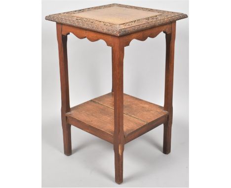 A Mid 20th Century Square Topped Oak Occasional Table with Deeply Carved Foliate Border to top and Planked Stretcher Shelf, 4