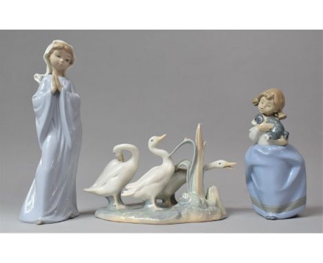 A Collection of Two Nao Girl Figures and a Lladro Group 