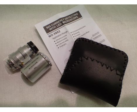 Cased 60x magnification currency/jewellery deleting loupe with LED light and instruction. P&amp;P Group 1 (£14+VAT for the fi