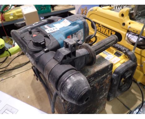 Makita corded hammer drill. Not available for in-house P&amp;P, contact Paul O'Hea at Mailboxes on 01925 659133. All electric