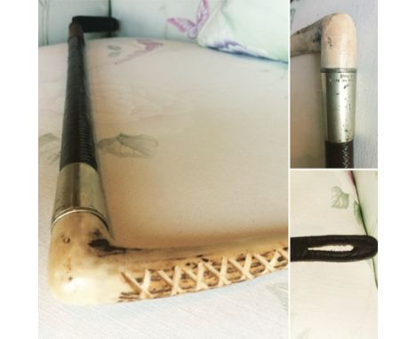 An early to mid 20th century riding crop with worked antler handle,&nbsp;brushed steel collar, platted leather shaft and sadd