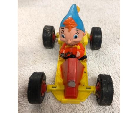 Vintage plastic toy, Noddy in a racing car. Unboxed and play worn.