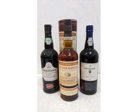 Two bottles of late vintage Port Grahams 1989, Warre's 1992 and one bottle of Glenmorangie malt Whisky Sherrywood finish, 75c