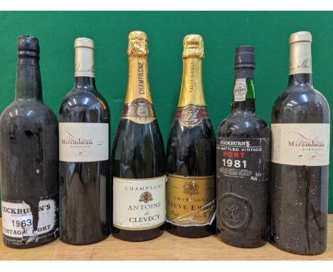 A box containing one bottle of Cockburns Vintage Port 1963, a bottle of Cockburns late Bottled Vintage Port 1981, two bottles
