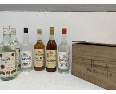 A boxed Harrods four bottle collection to include Gin, Brandy, Scotch Whisky, Vodka A/F and tow bottles of Bacardi 