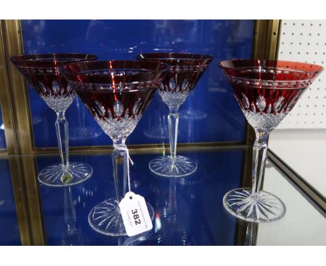 A set of four Waterford ruby flashed and cut champagne cocktail glasses Condition Report: Available upon request