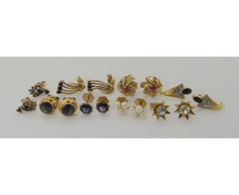 A collection of 9ct gold and yellow metal earrings, to include sapphire and ruby examples, weight combined 11.1gms Condition 