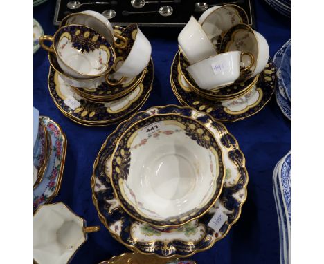 Four Royal Worcester dishes in 'Old Worcester Scale Blue', painted with exotic birds, and insects, together with a Royal Crow