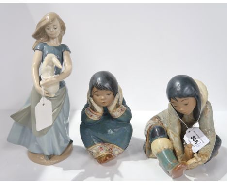 Two Lladro Eskimo children and a Nao figure of a girl and rabbit Condition Report: Available upon request