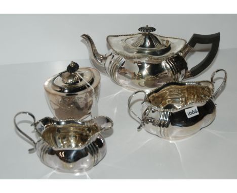 A three piece EP tea service and a tea caddy Condition Report: Available upon request