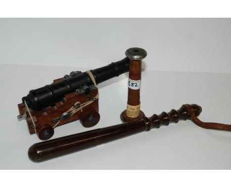 A hardwood truncheon, book trough, table canon and egg timer (4) Condition Report: Available upon request