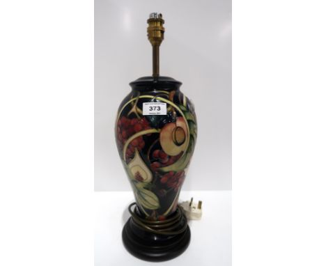 A Moorcroft Queen's Choice pattern table lamp 46cm high Condition Report: Available upon request