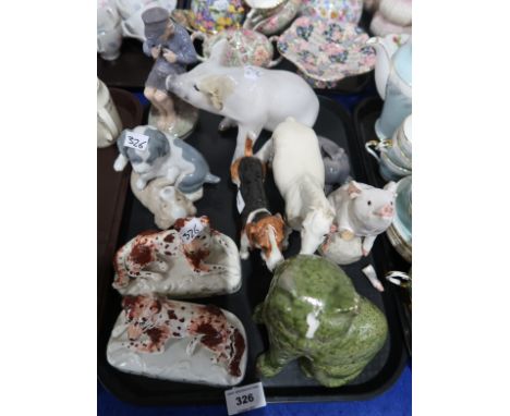 A lot comprising a Royal Copenhagen pig 414, figure of a boy 905, a figure of a dog 1407,Royal Doulton American Foxhound HN25