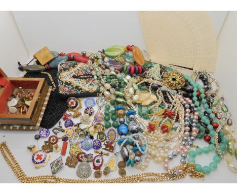 A collection of enamel badges, a Queen Mary's Own lapel badge and buttons, a silver coral brooch and earring set, and other i