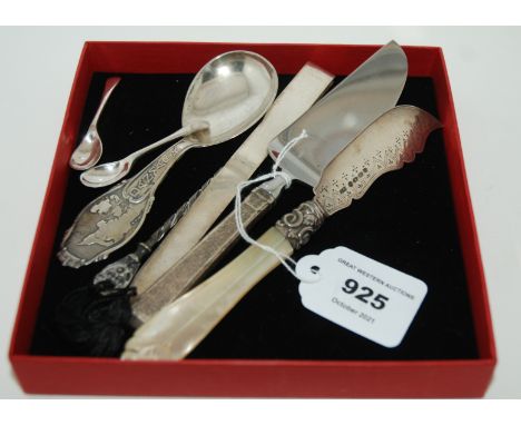 A lot comprising a silver-handled cake slice, a silver and mother of pearl butter knife, an 800 silver letter opener, a white