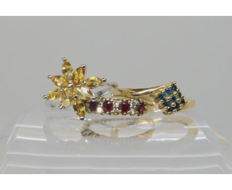 A 9ct gold blue diamond ring, size N1/2, a 9ct ruby and diamond ring size K, and a yellow gem set ring stamped 9k, weight com