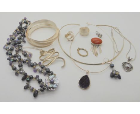 A silver bangle, rings and other items Condition Report: Not available for this lot