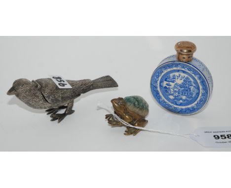 A lot comprising a novelty white-metal pin cushion modelled as a frog, a lemon squeezer modelled as a bird and a blue and whi