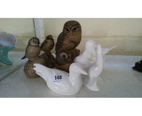 A Poole Pottery Barbara Linley Adams stoneware model of a little owl together with an owl chick and two birds together with f