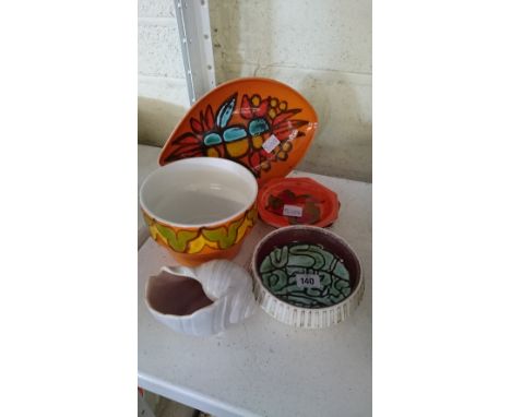 Six various Poole Pottery items.