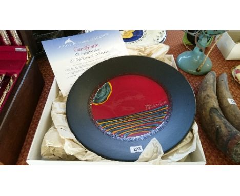 A Poole Pottery Millennium charger with Certificate of Authentication, 860/2000 in original box.