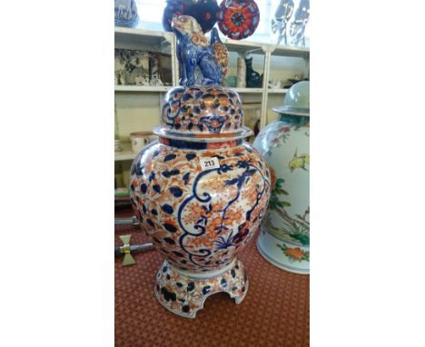 A large early 20th century Imari porcelain ginger jar on stand with Dog of Fo finial (af).