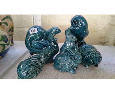 Seven various Poole Pottery blue glazed animal and bird ornaments.