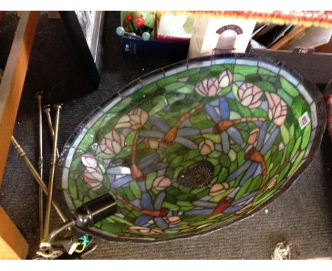 A large Tiffany style ceiling light shade.