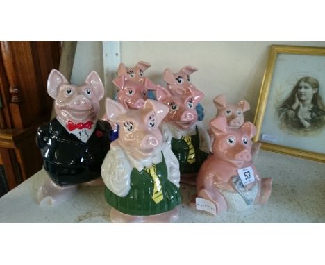 Eight various Wade chine NatWest piggy banks.
