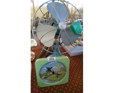 A mid 20th century Frost electric table fan together with a Metamec automaton electric clock decorated with windmill and land