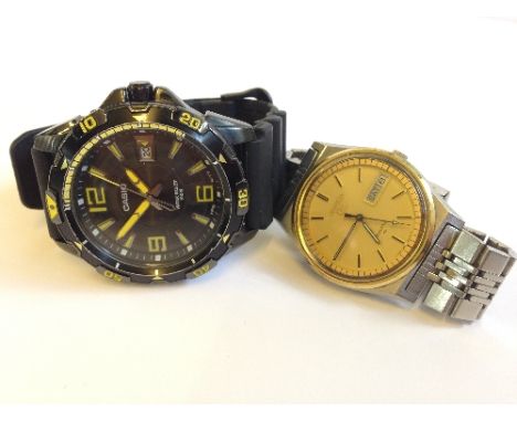 A black Casio quartz movement gentleman's wristwatch together with a gentleman's Seiko 5 wristwatch.