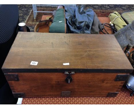A metal bound small hardwood trunk.