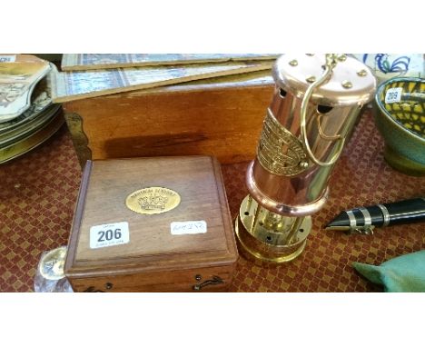 A replica copper and brass miner's lamp together with a replica nautical sextant in wooden case.