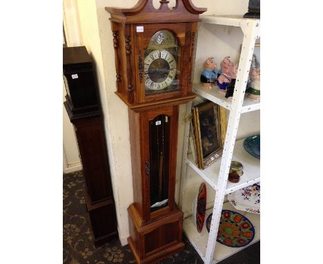 A modern mahogany effect longcase clock with brass and silver effect dial with rising sun and moon chain driven movement by t