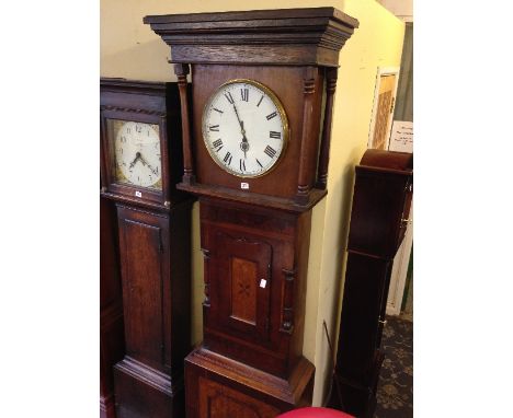 A large 19th century oak and mahogany longcase clock case with later dial and movement.