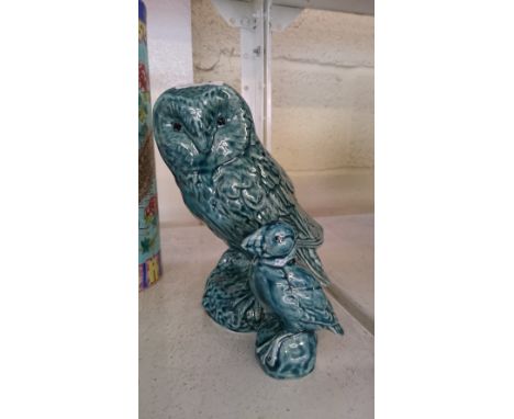 A Poole Zone blue glazed pottery model of an owl together with a Poole small model of a puffin.