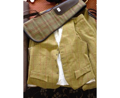 A three piece gentleman's check hunting outfit by Peter Hutchinson, Westow, York (Tailor to the Nobility) comprising jacket, 