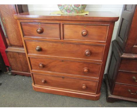 A Victorian mahogany chest of two over three drawers with rounded corners and bun handles, 112cm x 105cm x 50.5cm 