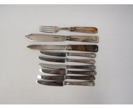 Six small silver handled knives together with an agate handled knife and fork and one other unmarked stone handled knife (9) 