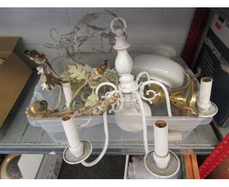 A crate containing various light fittings including modern electroliers and a pair of moulded brass Regency style wall sconce