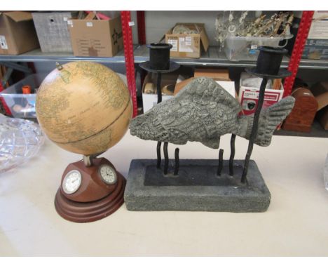 A wooden globe with clock, barometer &amp; hydrometer to base and a twin candle stick with stone effect fish 