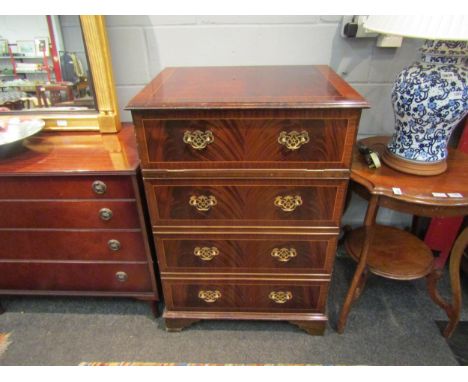 A mid 20th Century reproduction mahogany pseudo straight front chest of four long drawers, disguising a gramophone cabinet a/