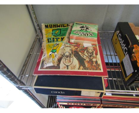 A Norwich City commemorative flag, World Cup final film reels and an action man 