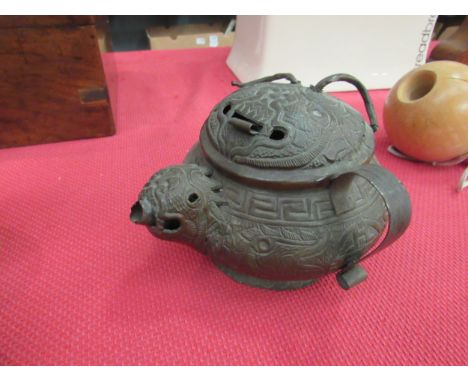An Oriental brass embossed teapot with geometric and dragon design 