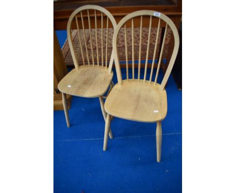 A pair of hoop and stick back kitchen chairs in the Ercol style