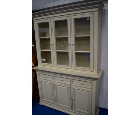 A modern neutral painted book or display cabinet having sideboard base, dimensions approx. W154cm H222cm D44cm