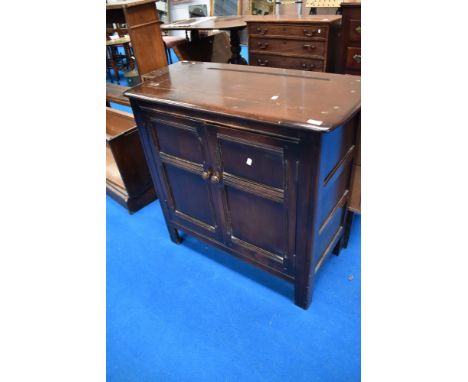 A vintage Ercol or similar narrow dresser base/side cabinet
