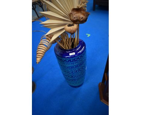 A German floor vase and dried floral arrangement, possibly lamp base with holes drilled to base